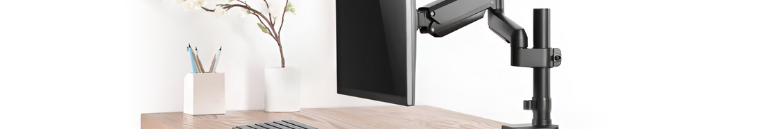What are the benefits of using monitor arms in the workplace?